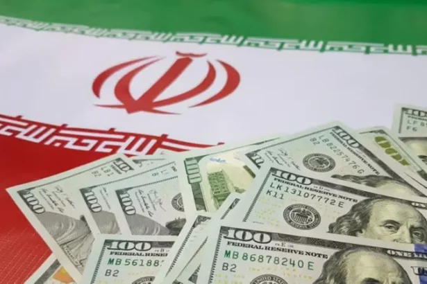 Iranian flag with U.S. dollar bills representing capital flight, state corruption, and economic challenges under sanctions.